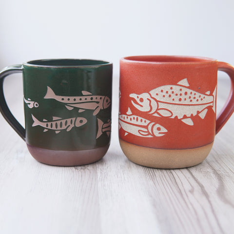 Salmon mugs in pine green and paprika red