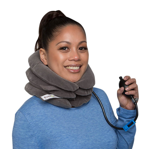 Woman finding pain relief using an EverRelief Neck Traction Device