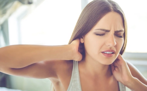 woman suffering from neck pain