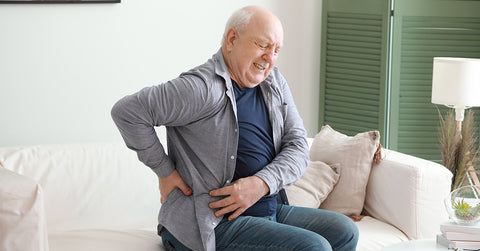 Sitting Down With Back Pain During Winter - Your Back Pain Relief