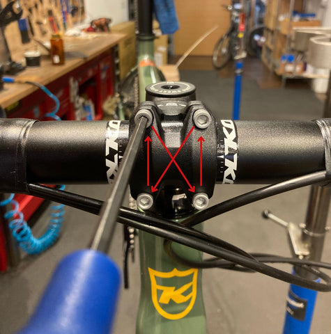 Tighten the handlebar to the stem in a criss-cross X pattern to ensure equal pressure is applied to the handlebar