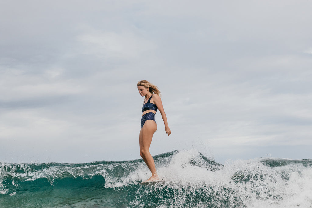 Miki Webster roadtests the new Salt Gypsy Luna Surf Crop. Sustainable style in the lineup shot by Mims Radford | www.saltgypsy.com #saltgypsy #sustainableswimwear #sustainablesurf #styleinthelineup #womenwhosurf