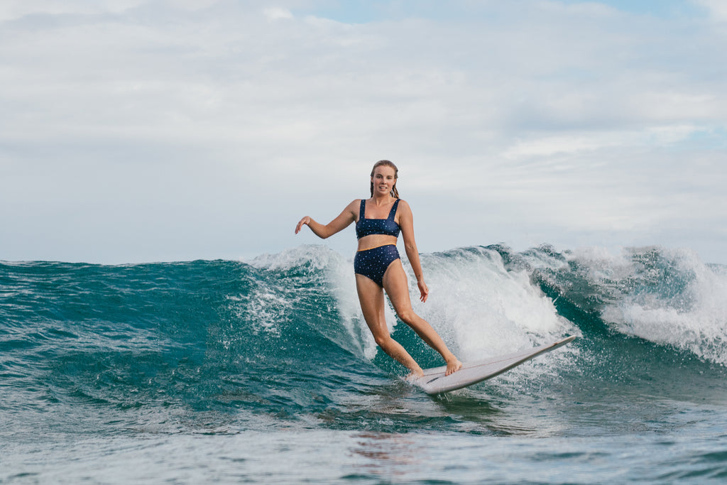 Miki Webster roadtests the new Salt Gypsy Luna Surf Crop. Sustainable style in the lineup shot by Mims Radford | www.saltgypsy.com #saltgypsy #sustainableswimwear #sustainablesurf #styleinthelineup #womenwhosurf