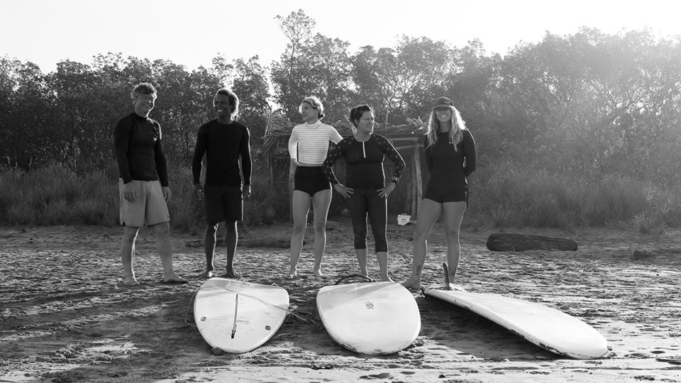 Sarah Hickson learns to surf at 53years old. Wearing Salt Gypsy sustainable surfwear at Surf Simply in Costa Rica. 