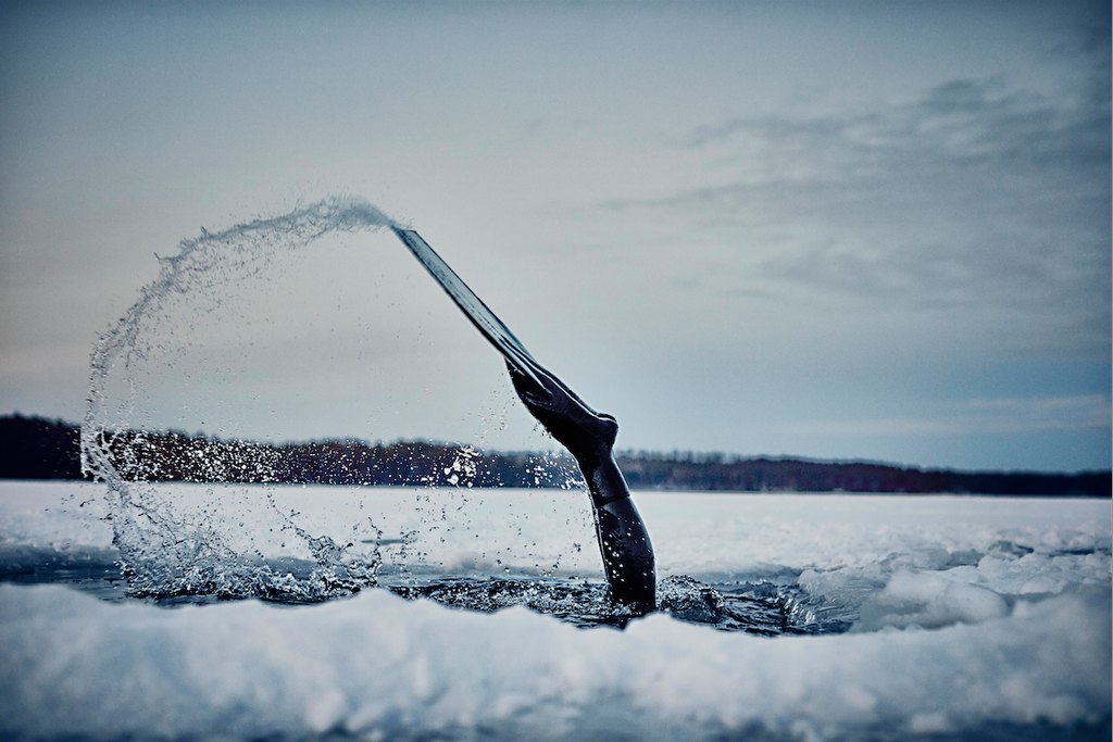 A still from Nowness featuring Finnish free diver Johanna Nordblad as she dives beneath a frozen lake
