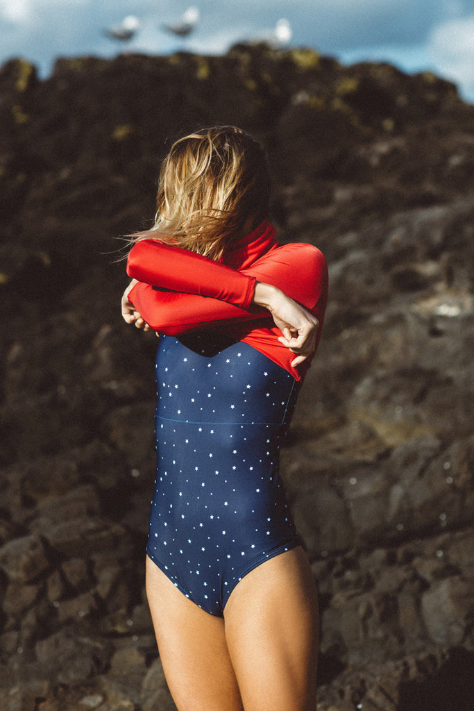 Montana Lower wears Salt Gypsy sustainable ocean activewear. The Navy & Gold Collection 2017 | www.saltgypsy.com #saltgypsy #activewear #activeswim #beachactive #womenwhosurf #surf #sustainableswim