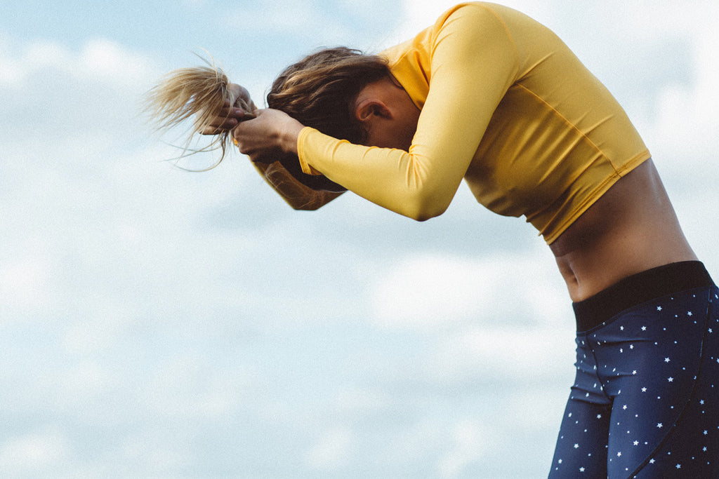 Montana Lower wears Salt Gypsy sustainable ocean activewear. The Navy & Gold Collection 2017 | www.saltgypsy.com #saltgypsy #activewear #activeswim #beachactive #womenwhosurf #surf #sustainableswim