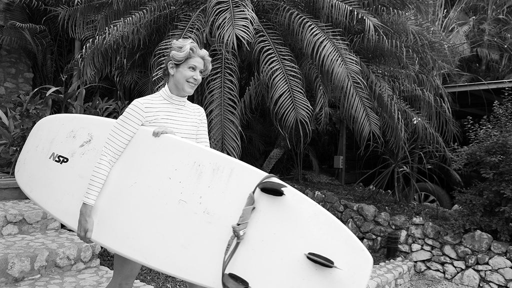 Sarah Hickson learns to surf at 53years old. Wearing Salt Gypsy sustainable surfwear at Surf Simply in Costa Rica. 