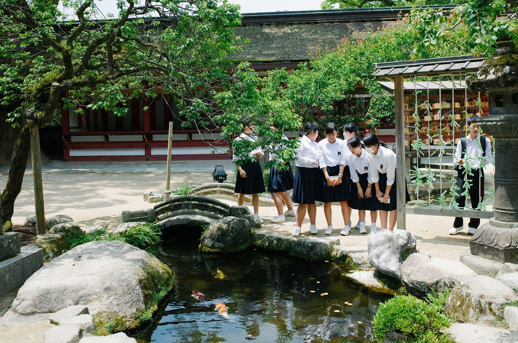 School children admiring a school garden.