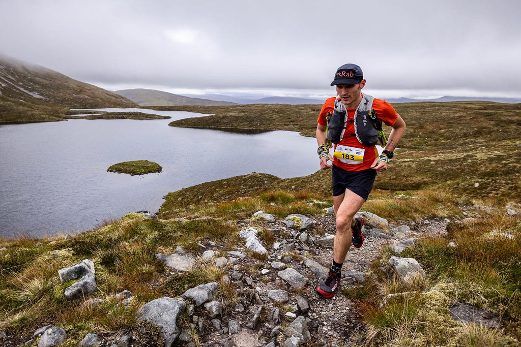 Runner George Fisher runs a trail beside a small tarn during Ben Nevis Ultra