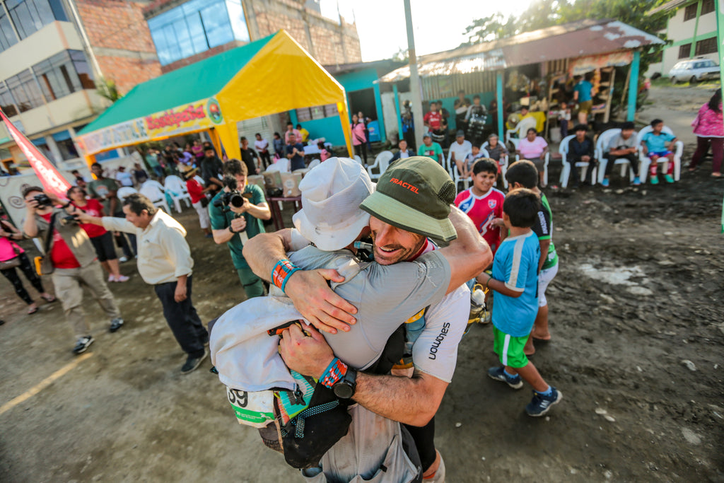 Jungle Ultra winner Jon Shield embraces a fellow runner