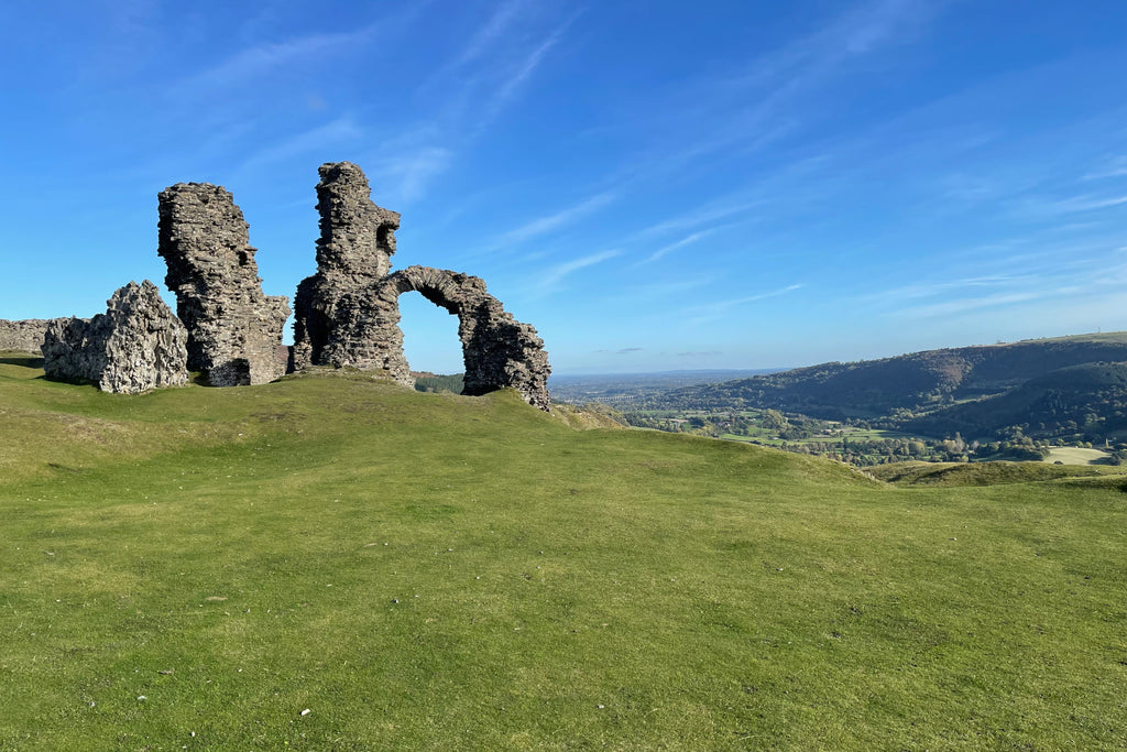 Dinas Bran Castle above Llangollen on a bright, blue sky day.