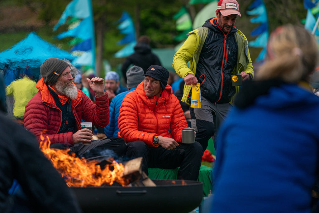 Multiday race competitors sit around a camp fire in the evening between stages of racing at the GL3D event.