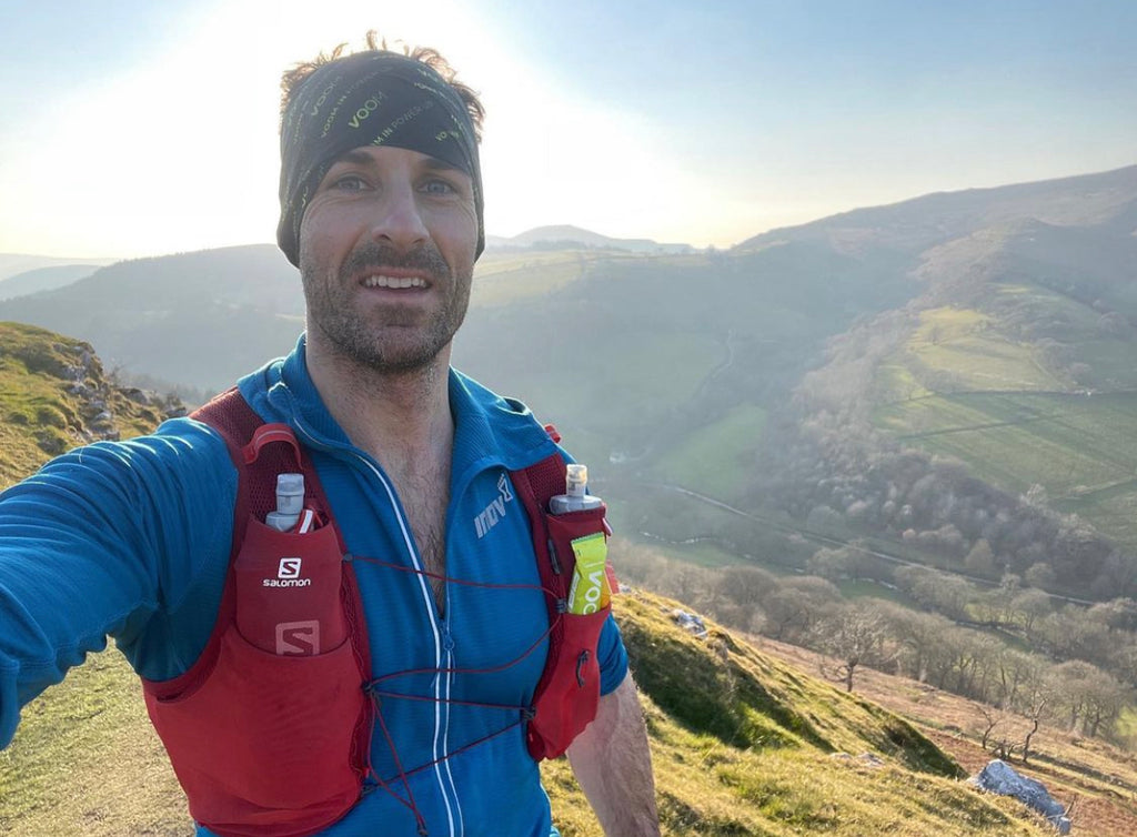 Ultra runner Jon Shield pauses at the top of a Welsh Mountain Pass during an off road training run.