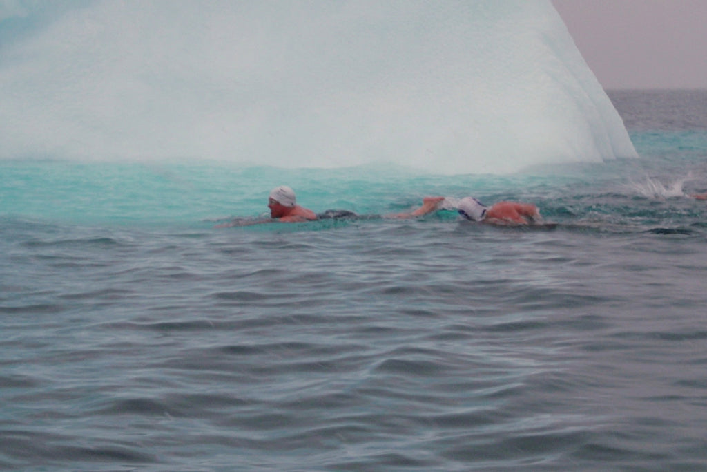 Ice swimmer Cath Pendleton swims past an iceberg in the Southern Ocean