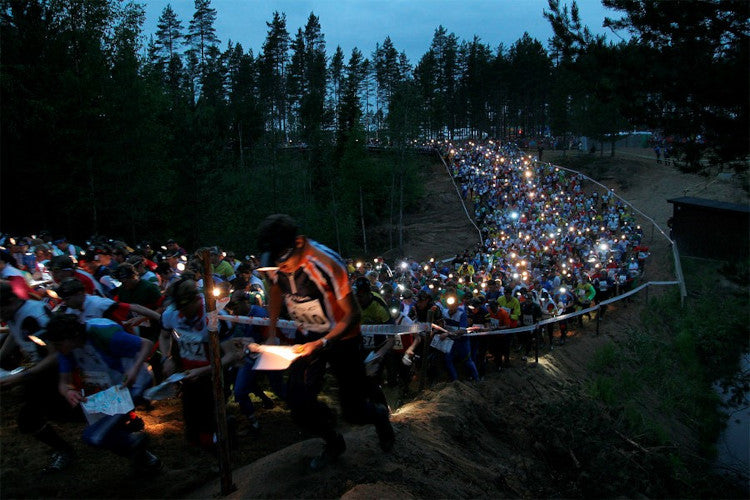 Thousands of orienteers head off with hear torches at the beginning of the Jukola orienteering event in Finland.