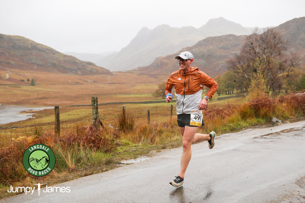 Andy Shelton from Team Acclerate Running beside Blea Tarn in the Langdale Half Marathon 2020 with the Langdale Pikes in the background.