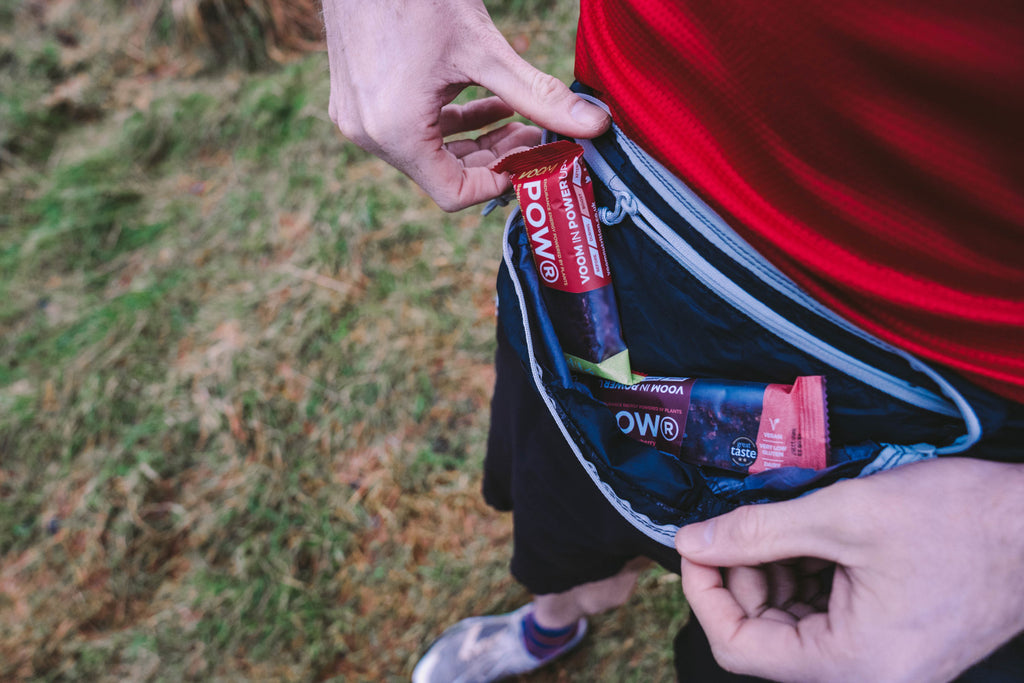 A runner's waist pack with two beetroot energy bars for energy on the go