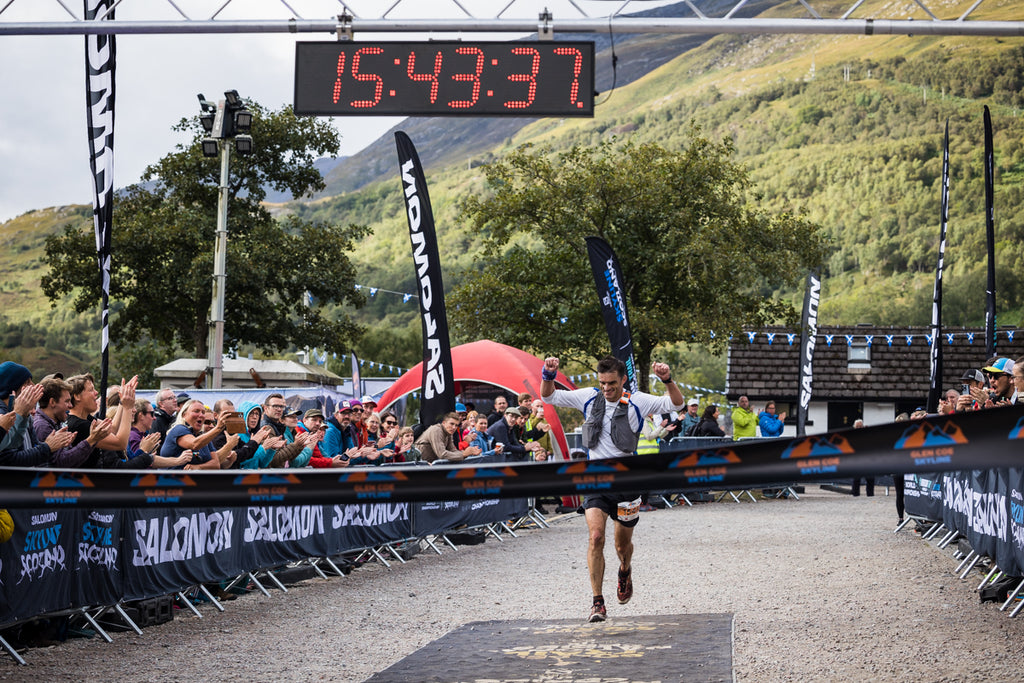 Race winner crossing the finish line at Skyrunning event in Scotland
