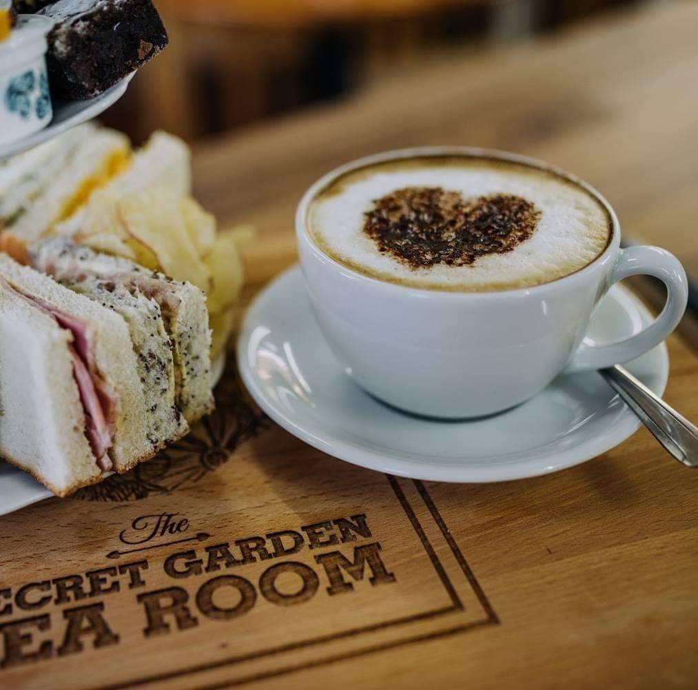 A cup of coffee and sandwiches at the secret garden cafe in Lincolnshire.