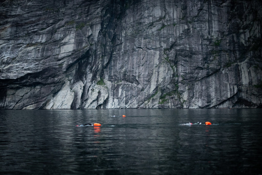 Cold open water swimming in a moody fjord during ThorXtri event.