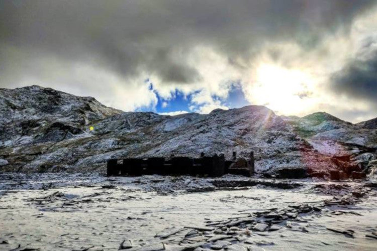 Runner Russell Bentley kitted out in winter running kit during a run in the Moelwynion Mountains in Snowdonia