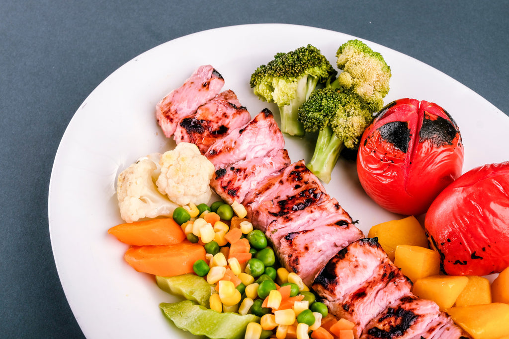 A plate of food including vegetables and meat