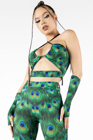 sexy woman wearing a green peacock print set of bell bottoms and v string crop top