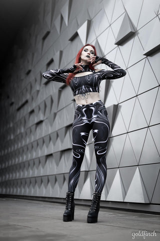 Sexy woman wearing a black marble print high waisted leggings