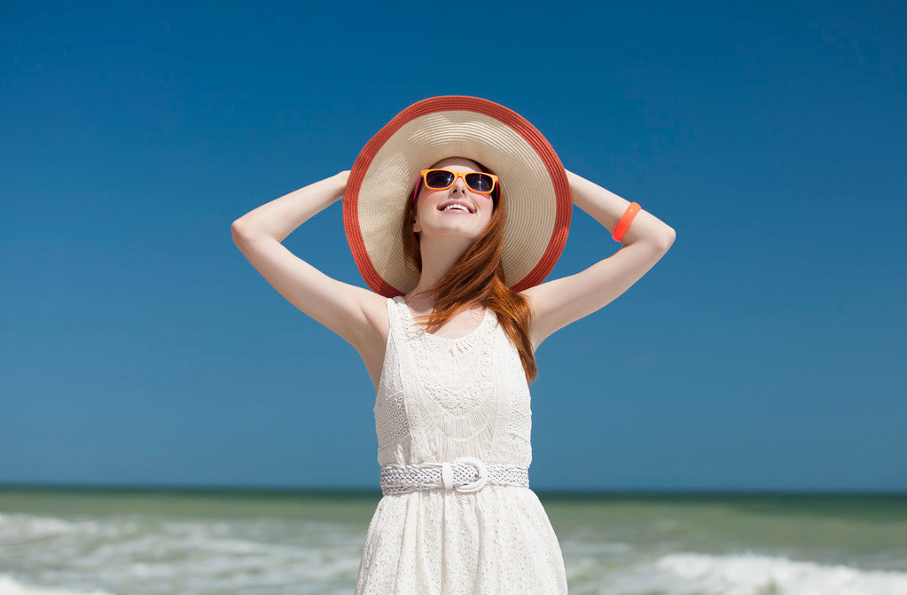 Redhead girl on the beack in spring time