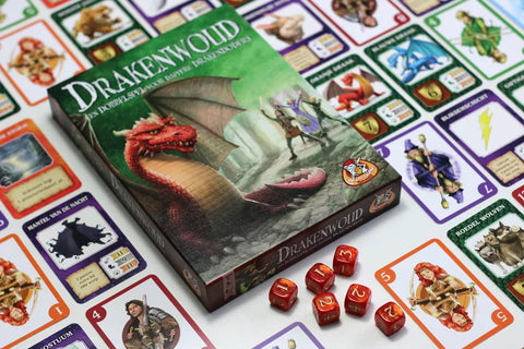 Dragonwood Game stock photo from manufacturer with cards, dice, and box laid out on a table for family game night