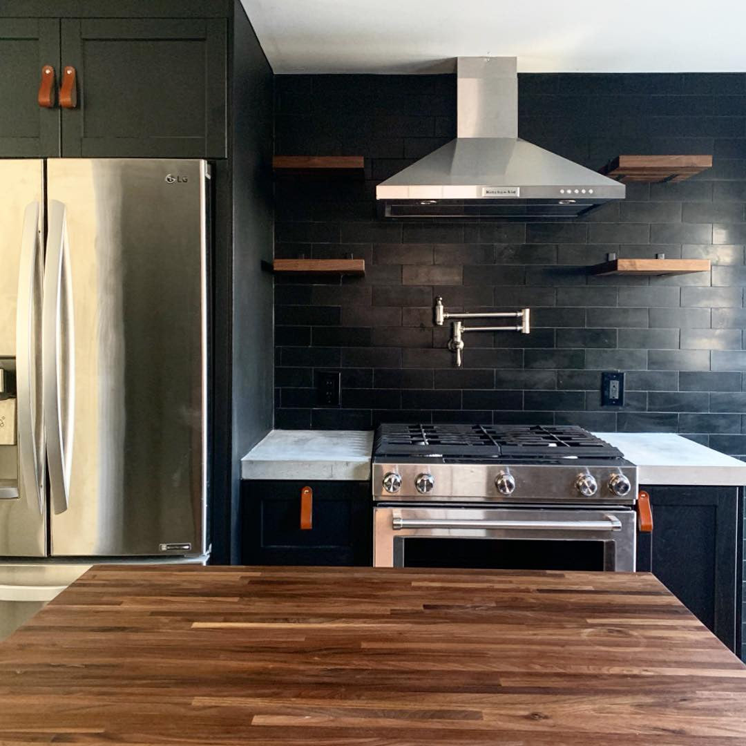 A gorgeous kitchen with leather drawer pulls