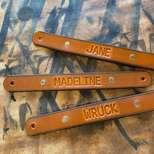 Family Names Labeled on Handles for Mud Room Cubbies