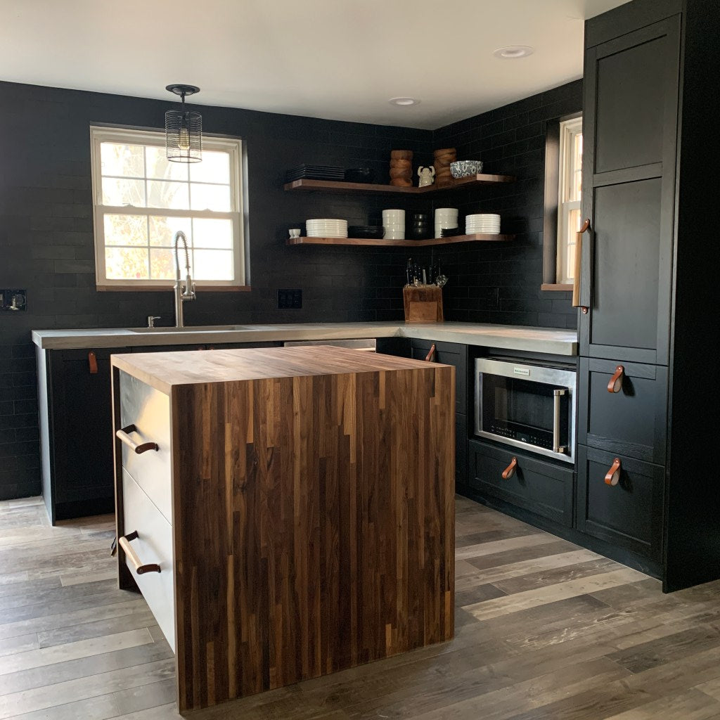 Black Stainless Steel Chef's Kitchen with Honey Leather and Wood Sellwood Handles