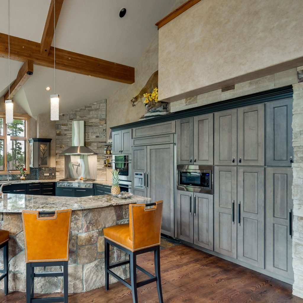 Colorado Chalet Kitchen Gray Cabinetry with Black Leather Handles and Honey Leather Bar Stools