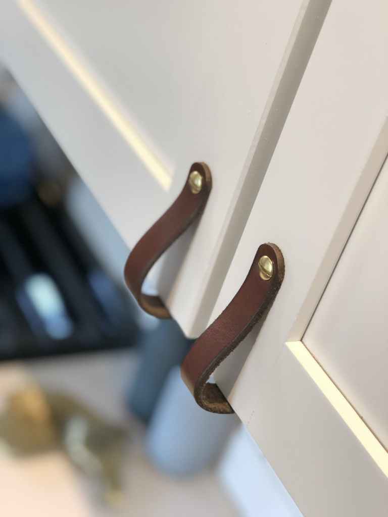 Off-White Kitchen Cabinetry with Dark Brown Lovejoy Leather Handles