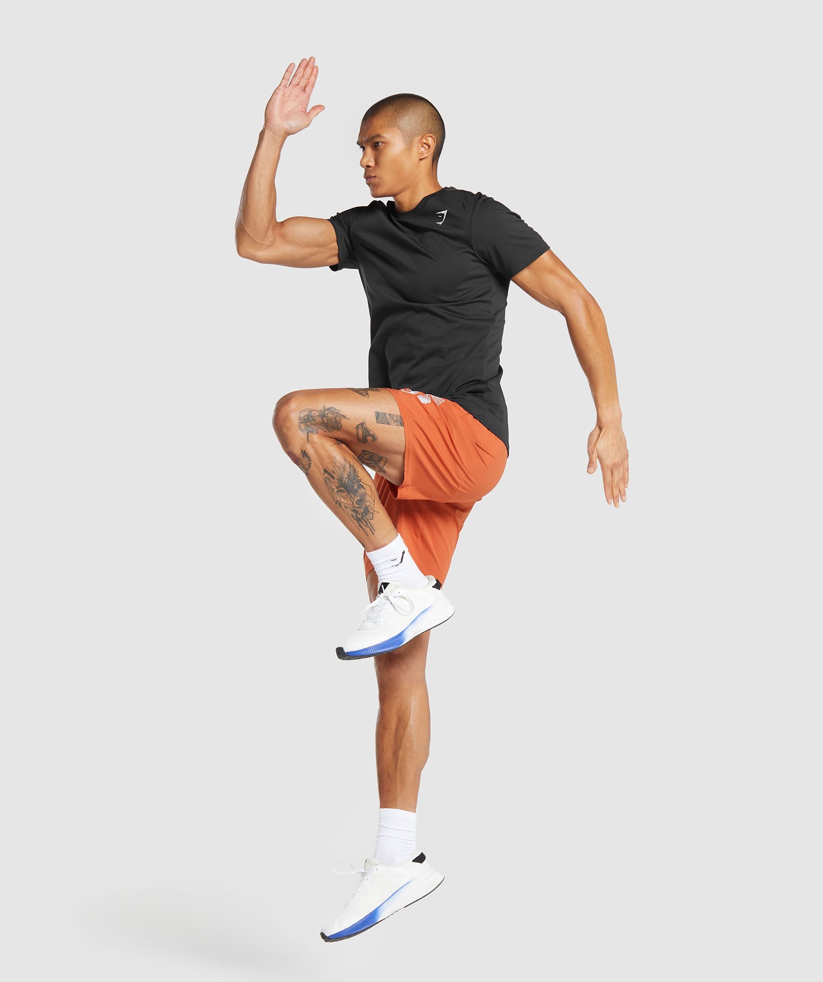 Hybrid Wellness 7" Shorts in Rust Orange - view 4