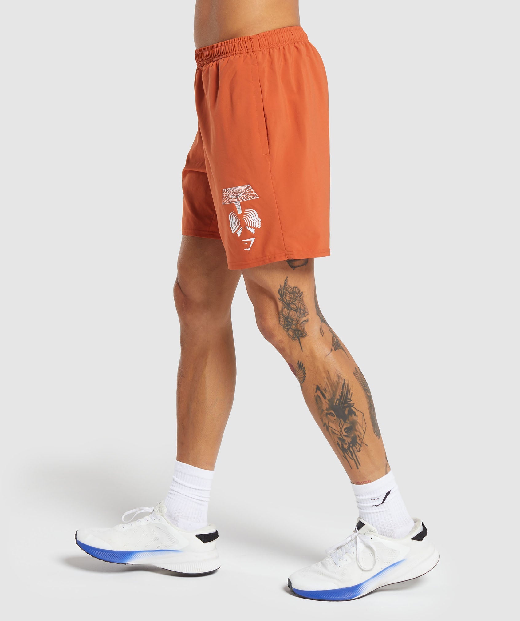 Hybrid Wellness 7" Shorts in Rust Orange - view 3