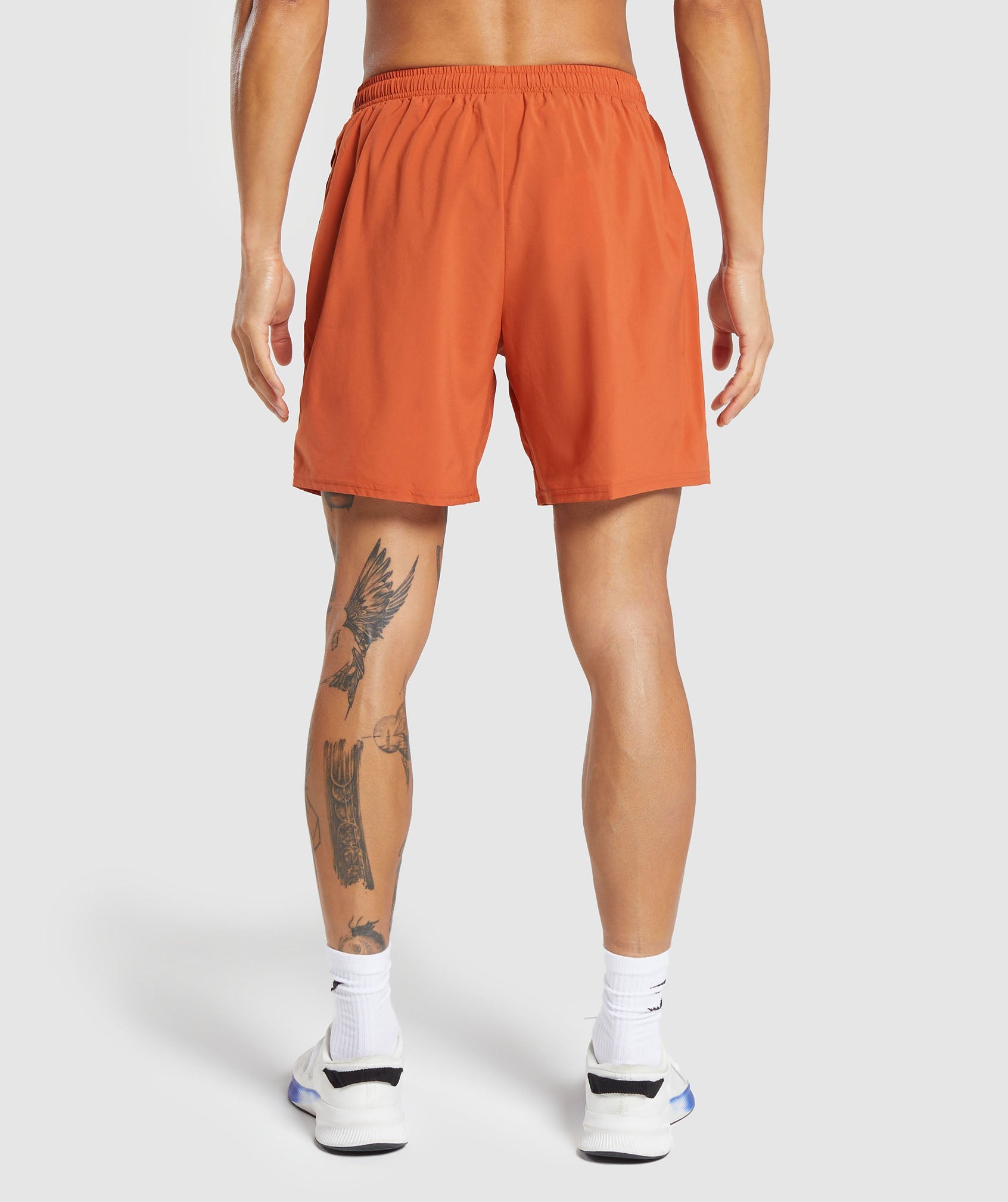 Hybrid Wellness 7" Shorts in Rust Orange - view 2