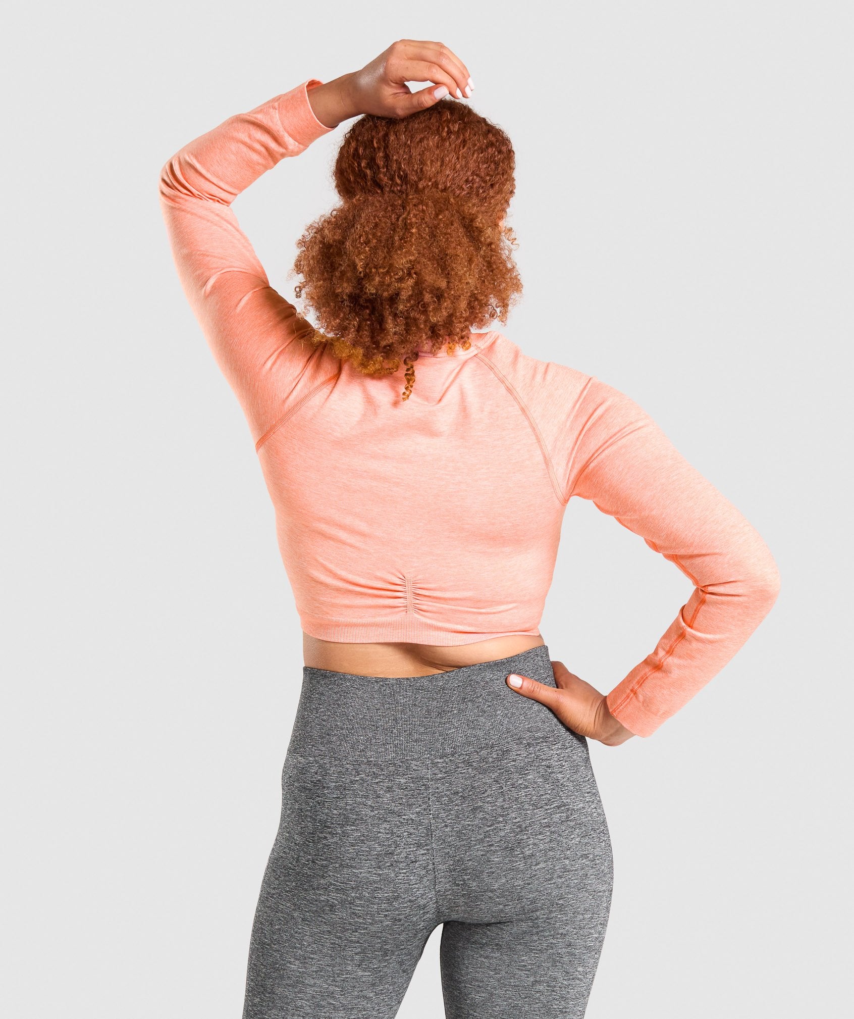 Adapt Marl Seamless Long Sleeve Crop Top in Orange