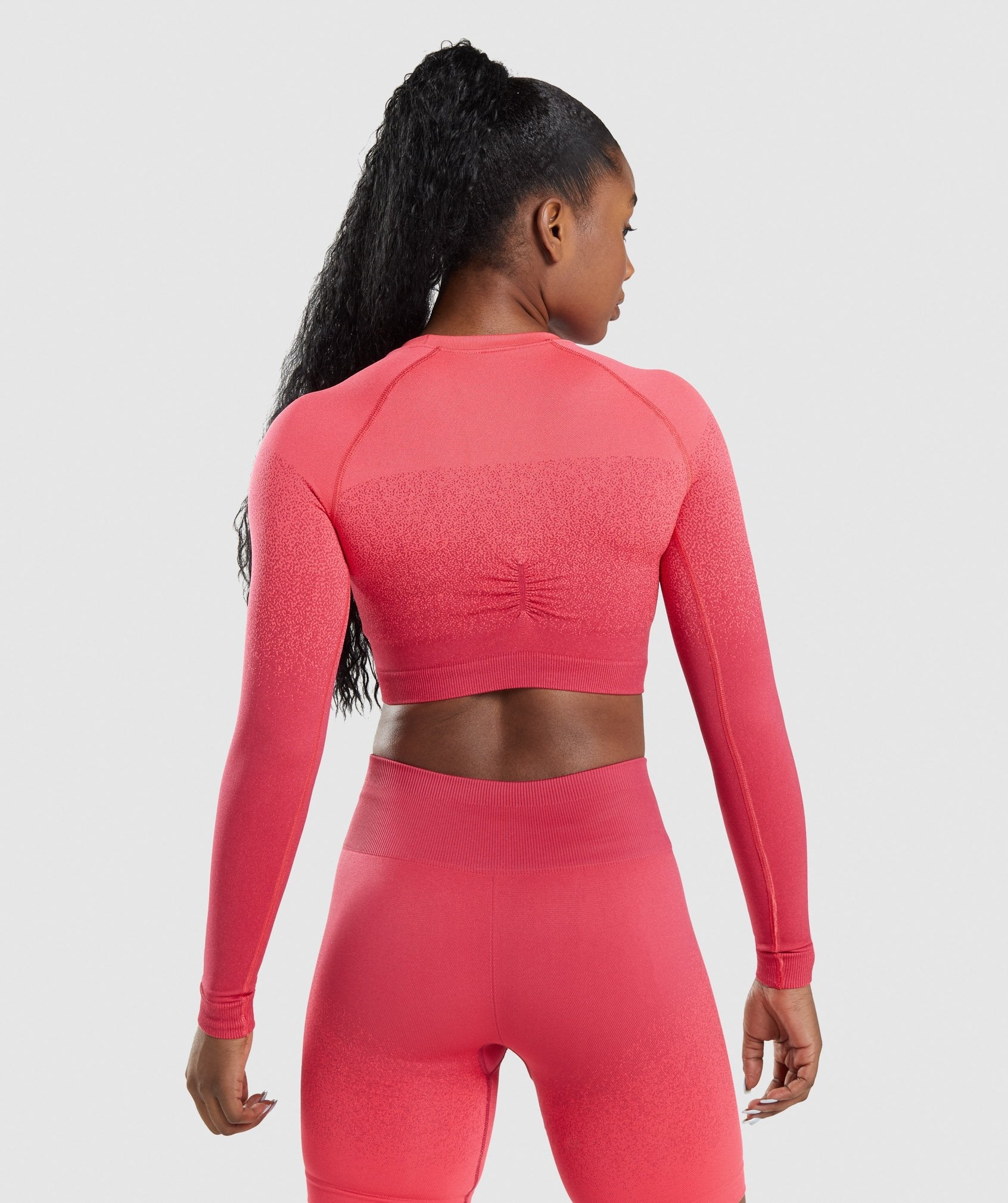 Adapt Ombre Seamless Long Sleeve Crop Top in Pink/Red