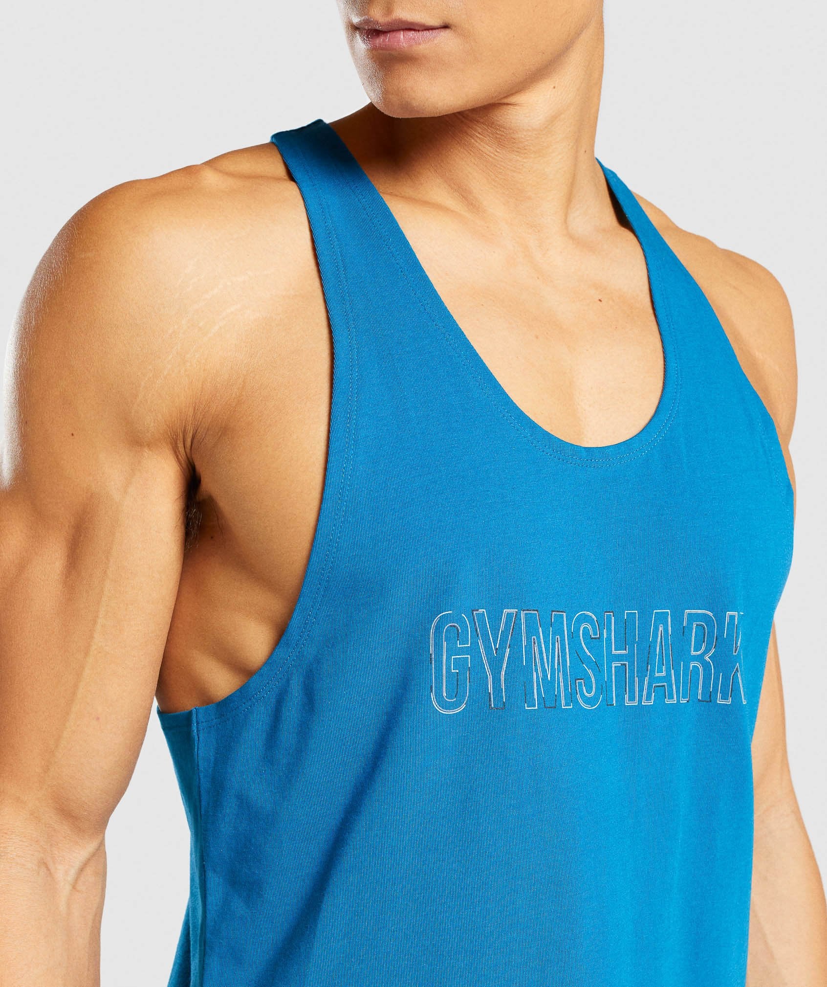 Image F shows close up of model wearing Outline Stringer in Teal