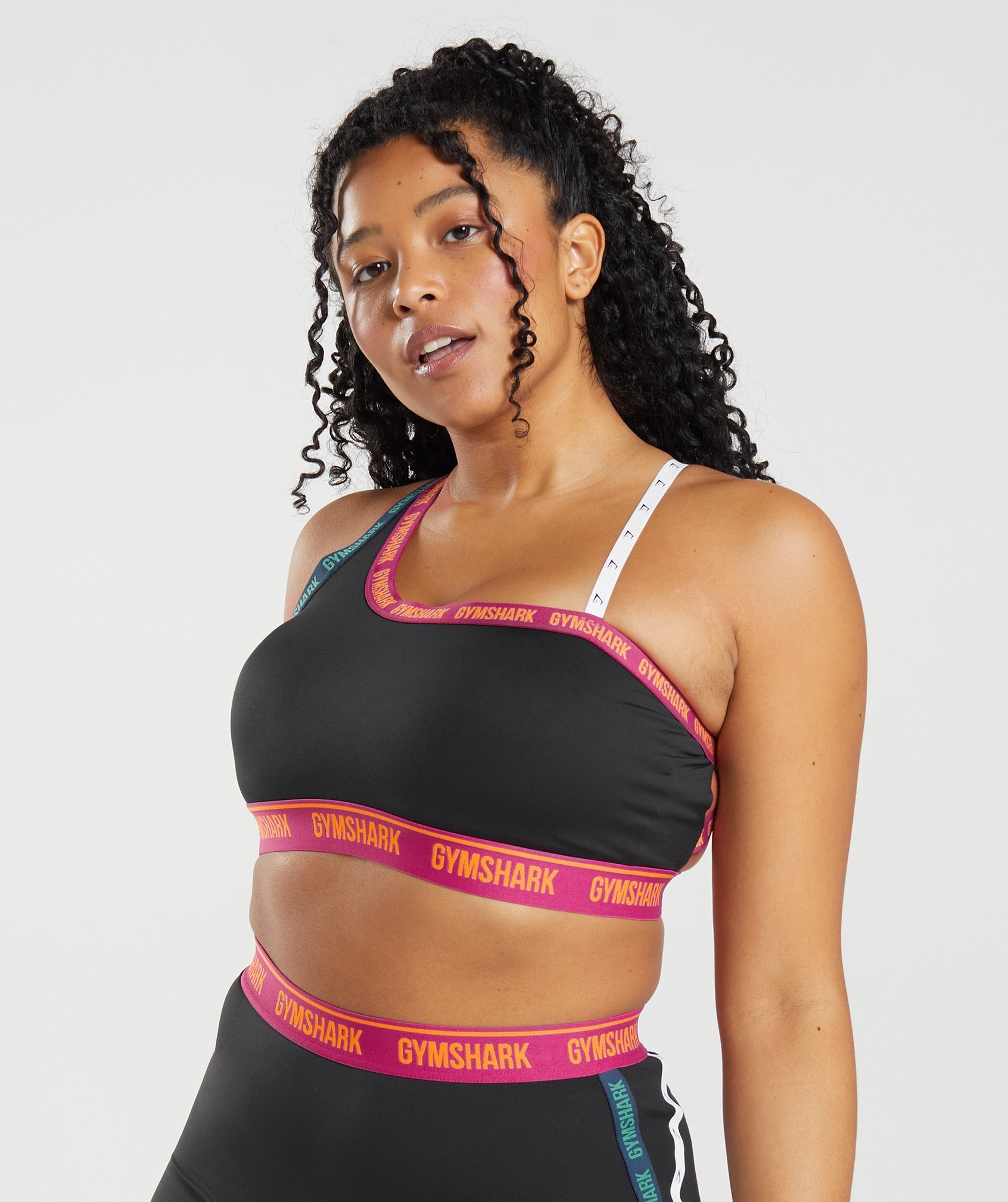 Strike Sports Bra in Black/Dragon Pink/Alpine Green - view 1