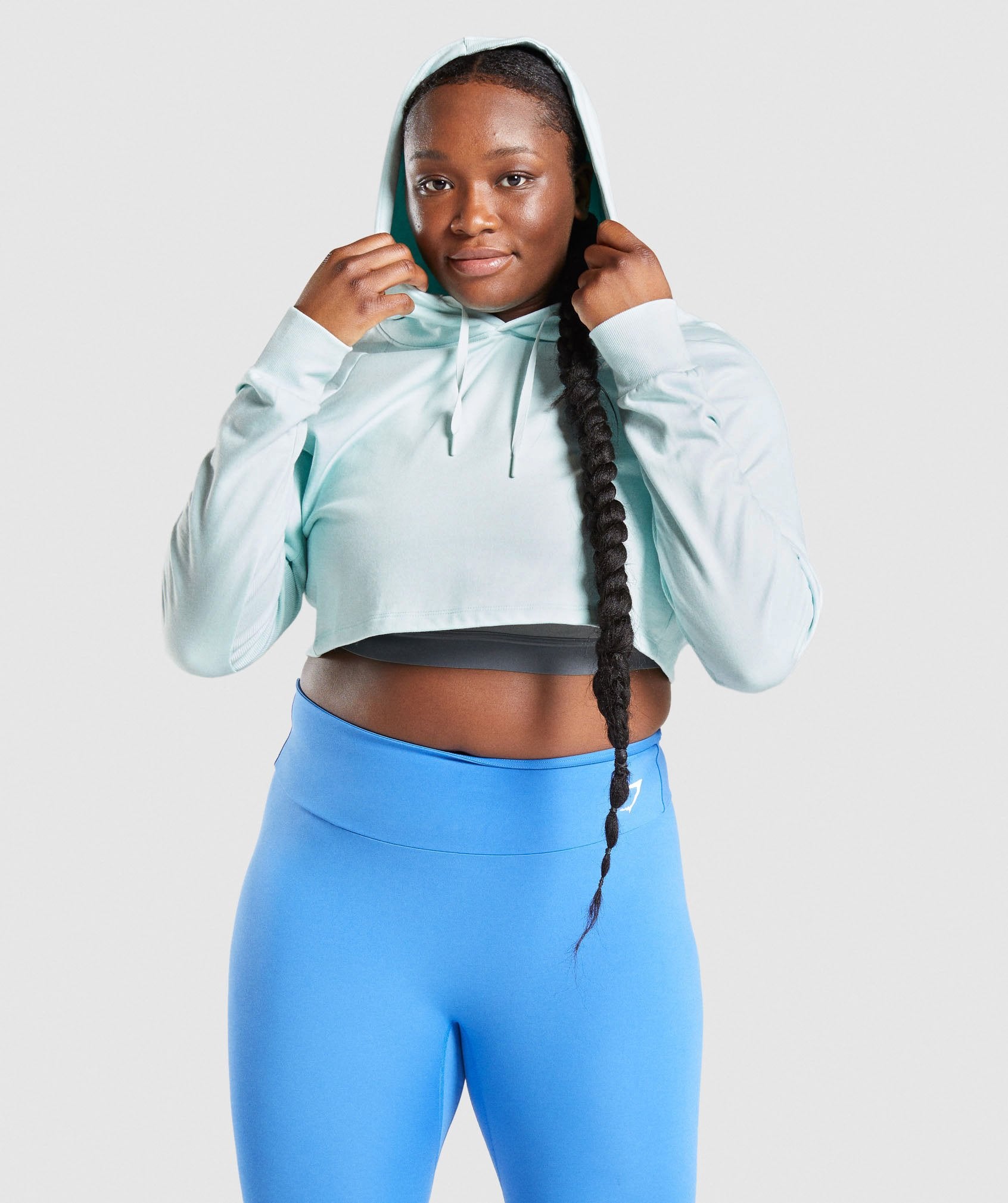 Image A shows front of model wearing Training Cropped Hoodie in Light Green