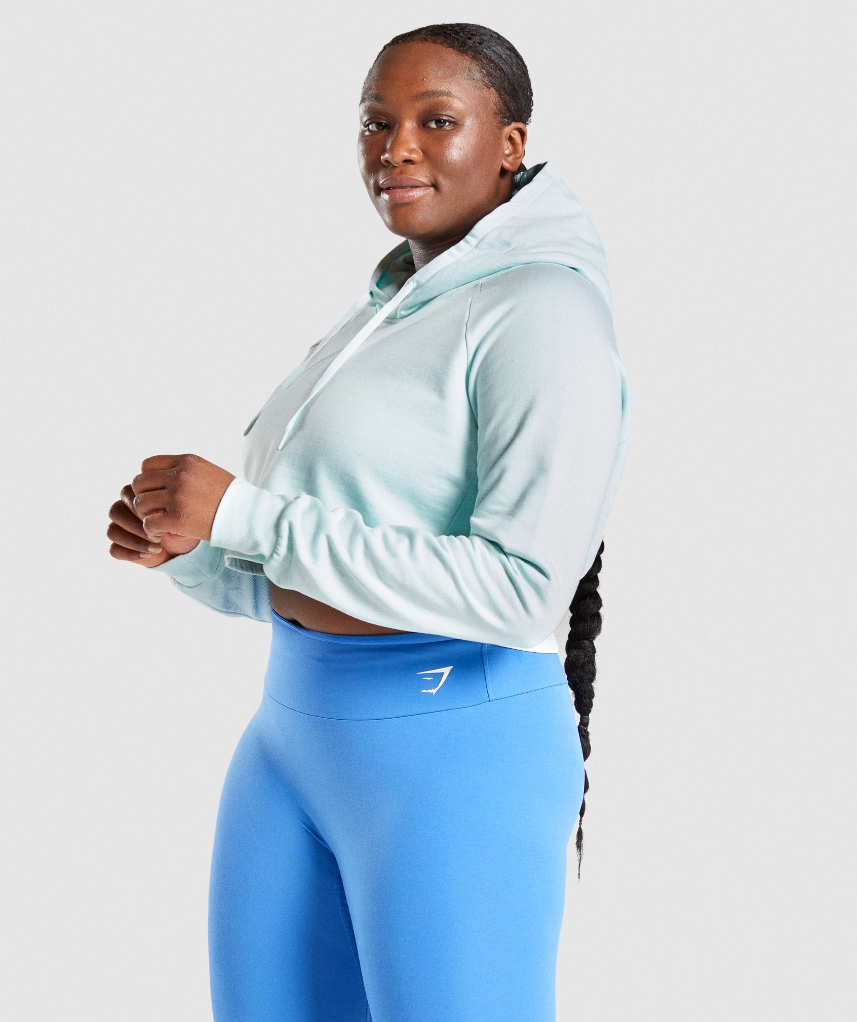 Image C shows side of model wearing Training CroppedHoodie in Light Green