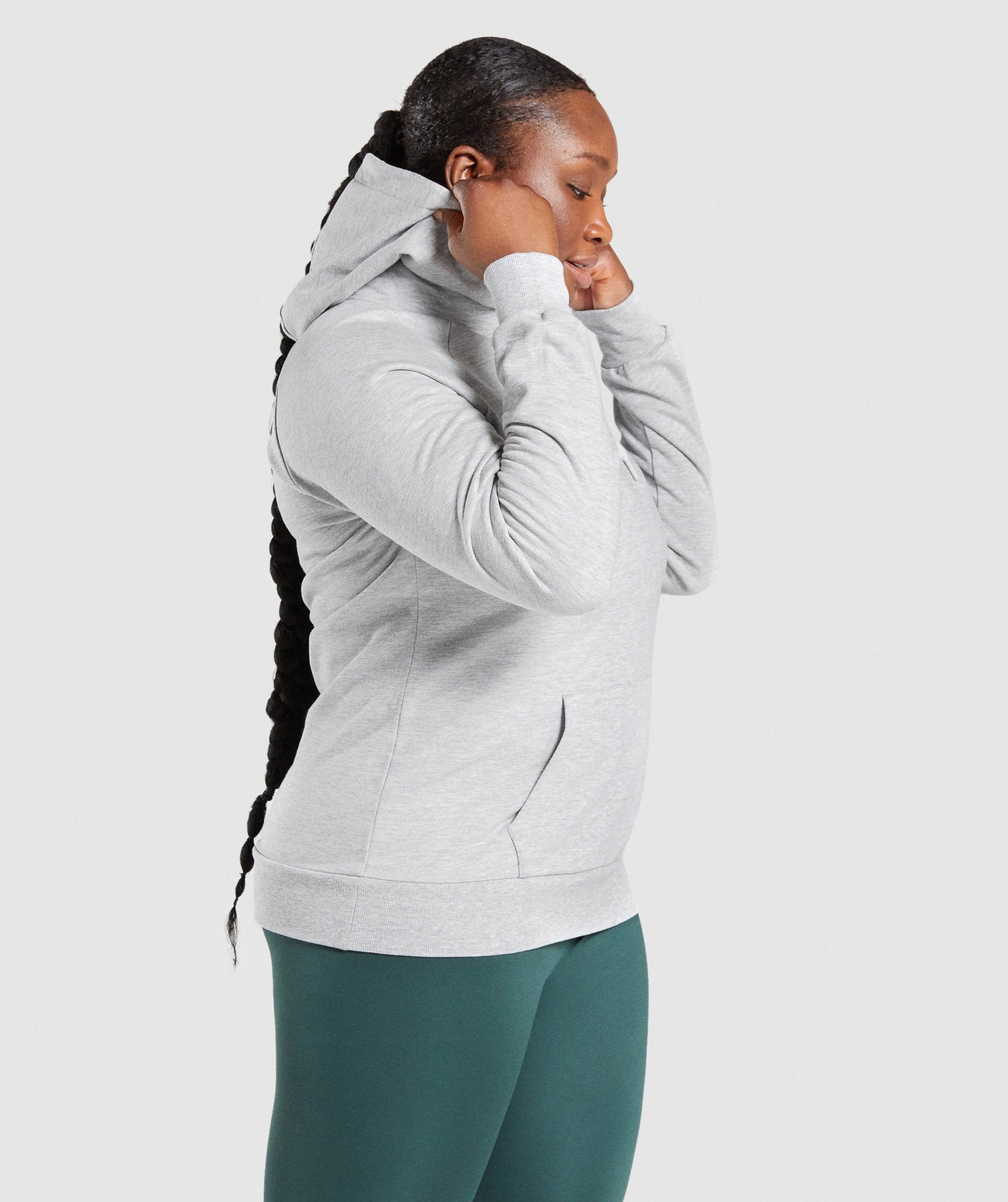 Image C shows side of model wearing Training Hoodie in Light Grey Marl