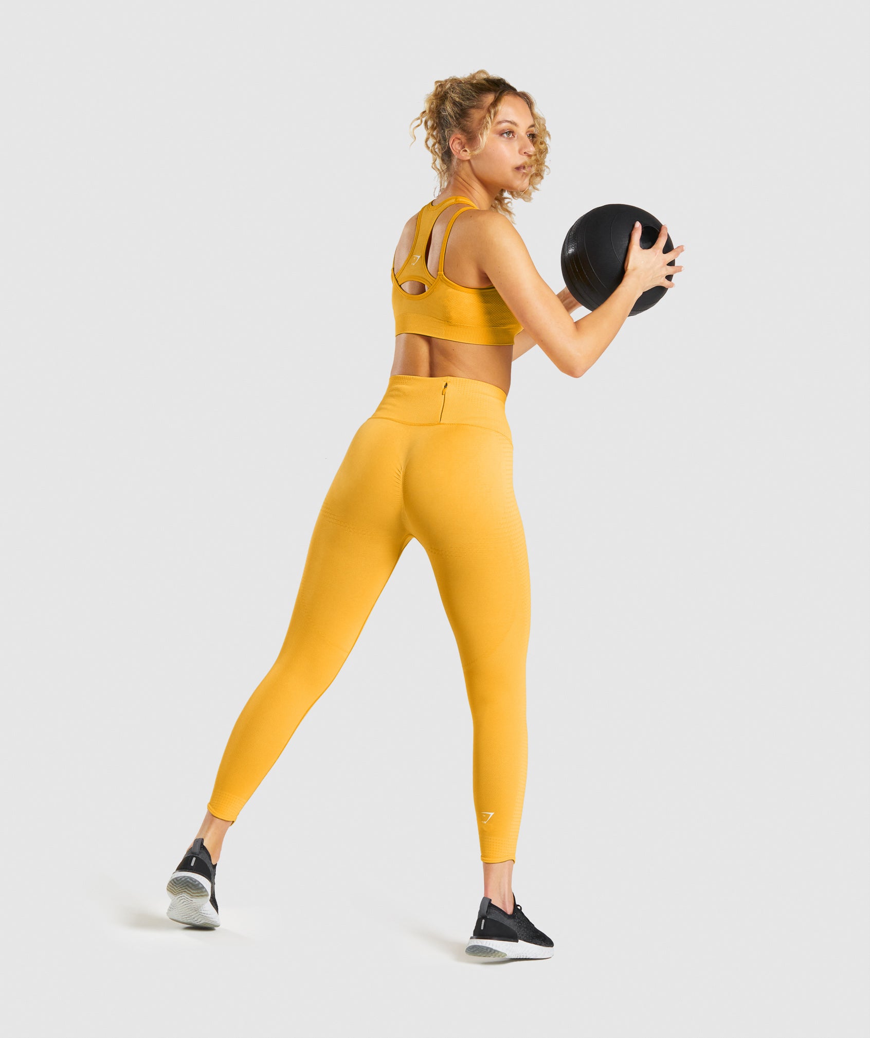 Gymshark Outfit: Yellow Vital Seamless Top and Teal Animal Leggings