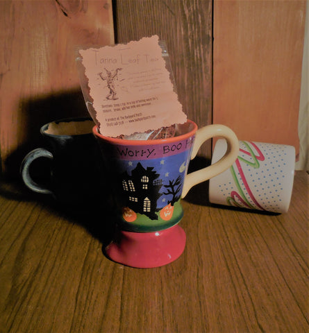 Red Tanna leaf tea in a spooky Halloween mug