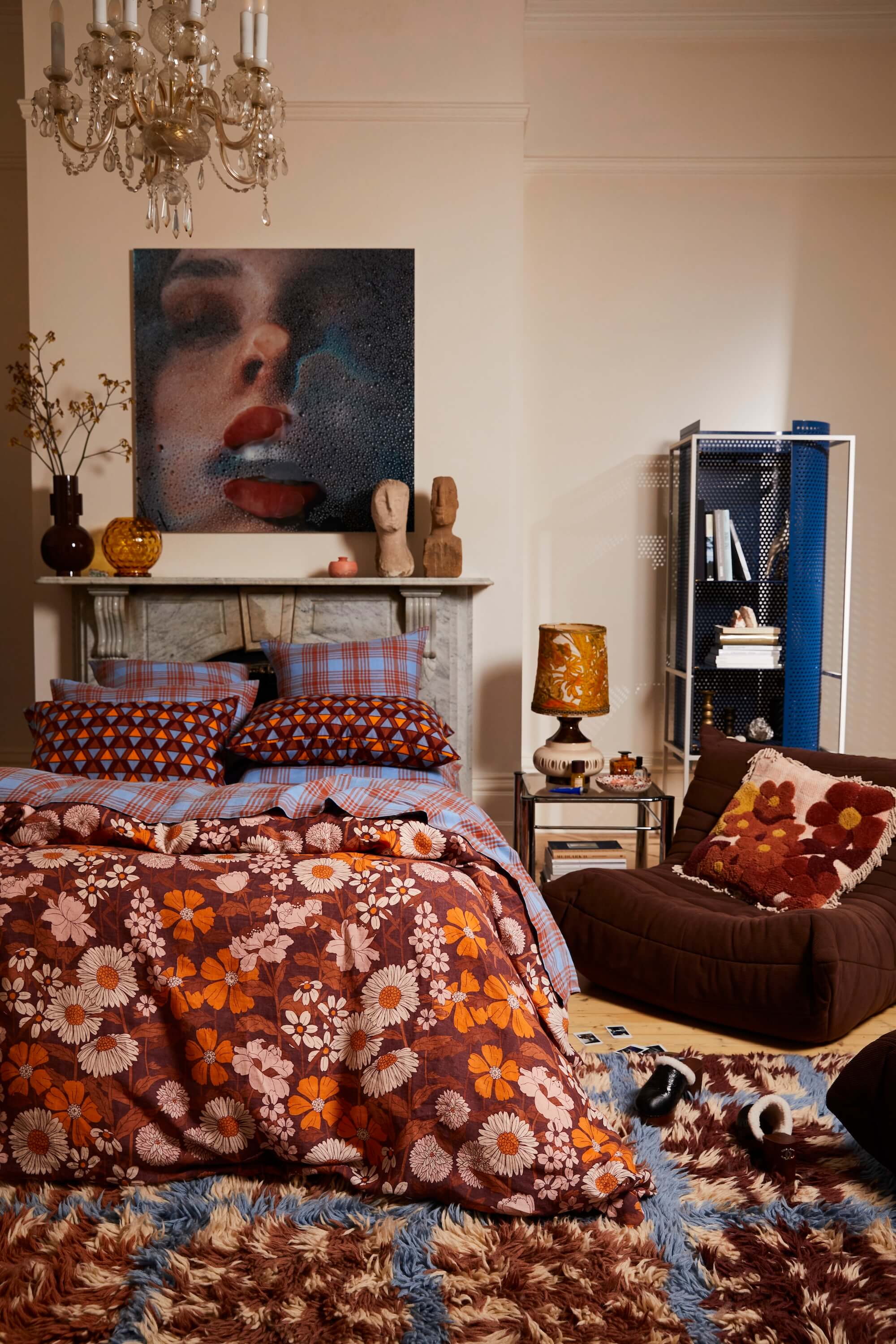 brown and blue bedroom with shag rug and floral quilt cover