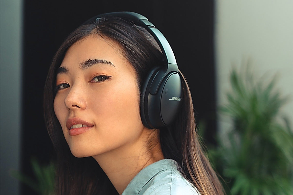 Woman with headphones especially designed to reduce noise